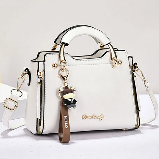 Printed monogram straddle leather bag. - Maison Novaire