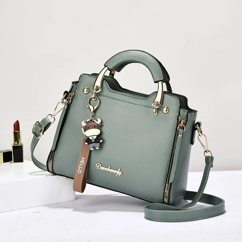 Printed monogram straddle leather bag. - Maison Novaire