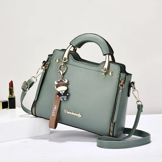 Printed monogram straddle leather bag. - Maison Novaire