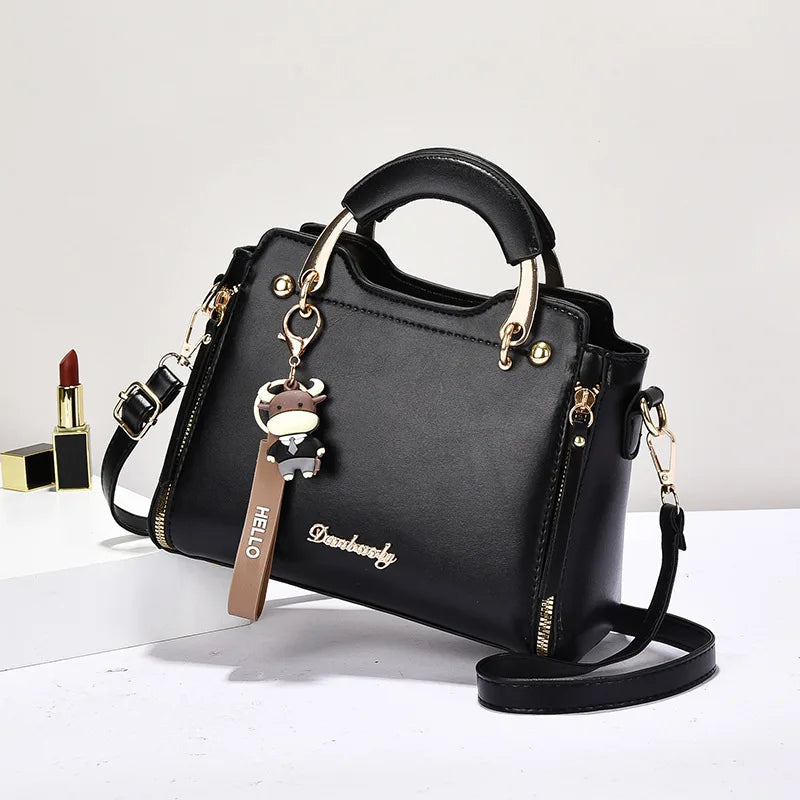 Printed monogram straddle leather bag. - Maison Novaire